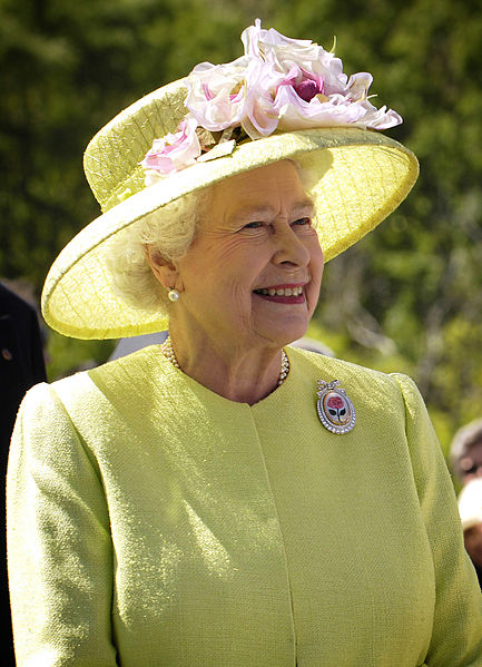 The Queen of England in a yellow dress